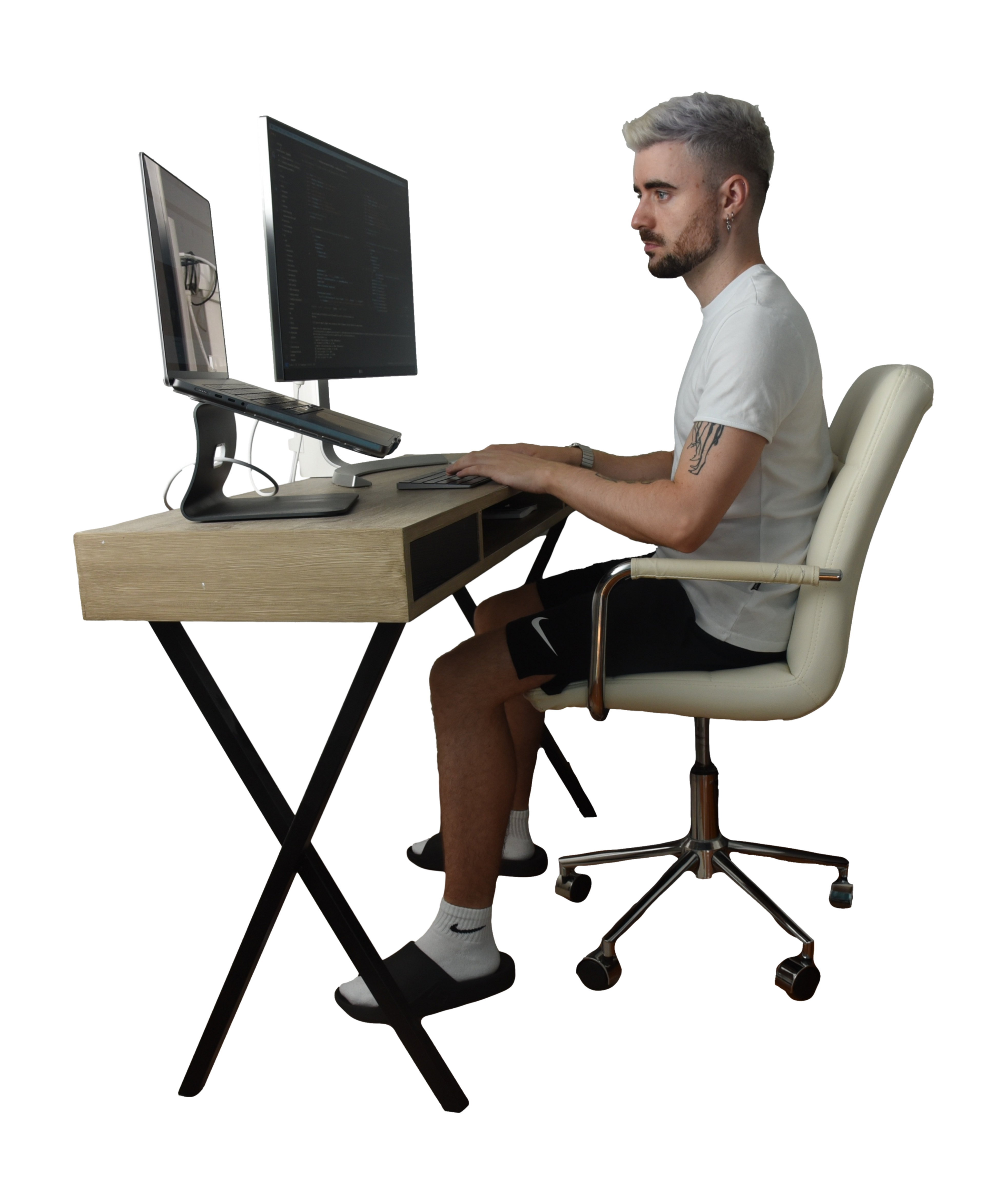 Photo of author sitting at a desk and writing code.